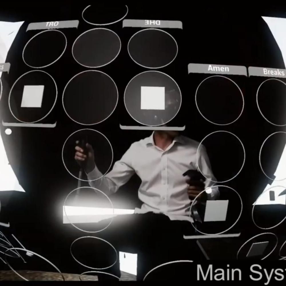 A person in a white shirt sits holding VR controllers, surrounded by a virtual interface with circular and square icons. The interface displays labels like DHE, Amen, and Breaks. The text Main Sys is partially visible at the bottom.