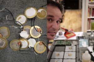 A split image: on the left, several round electronic components with wires lay on a textured surface; on the right, a man stands next to a workbench covered with tools and small electronic parts.