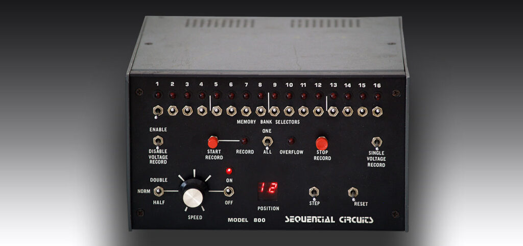 A vintage Sequential Circuits Model 800 step sequencer with switches, knobs, indicator lights, and labeled controls on a black metal front panel. The device displays the number 12 on a small red digital screen.