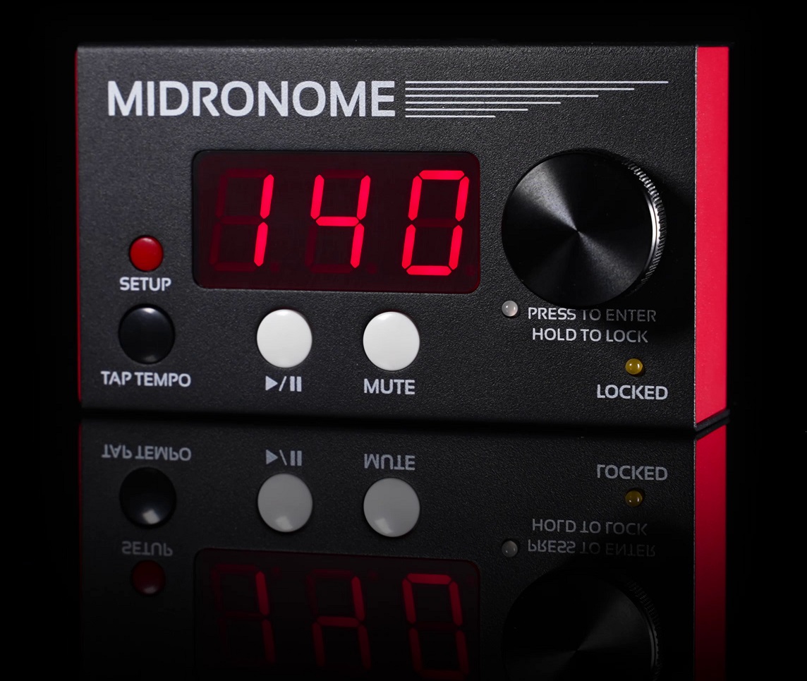 A digital metronome device labeled Midronome displays 140 in red LED numbers. It has a large black knob, several buttons, and a reflection visible below it against a black background.