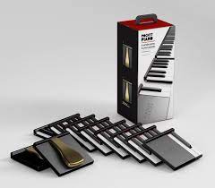 A set of sticky notes designed to resemble piano keys, arranged in front of the product box, which displays images of the notes and a piano keyboard graphic.