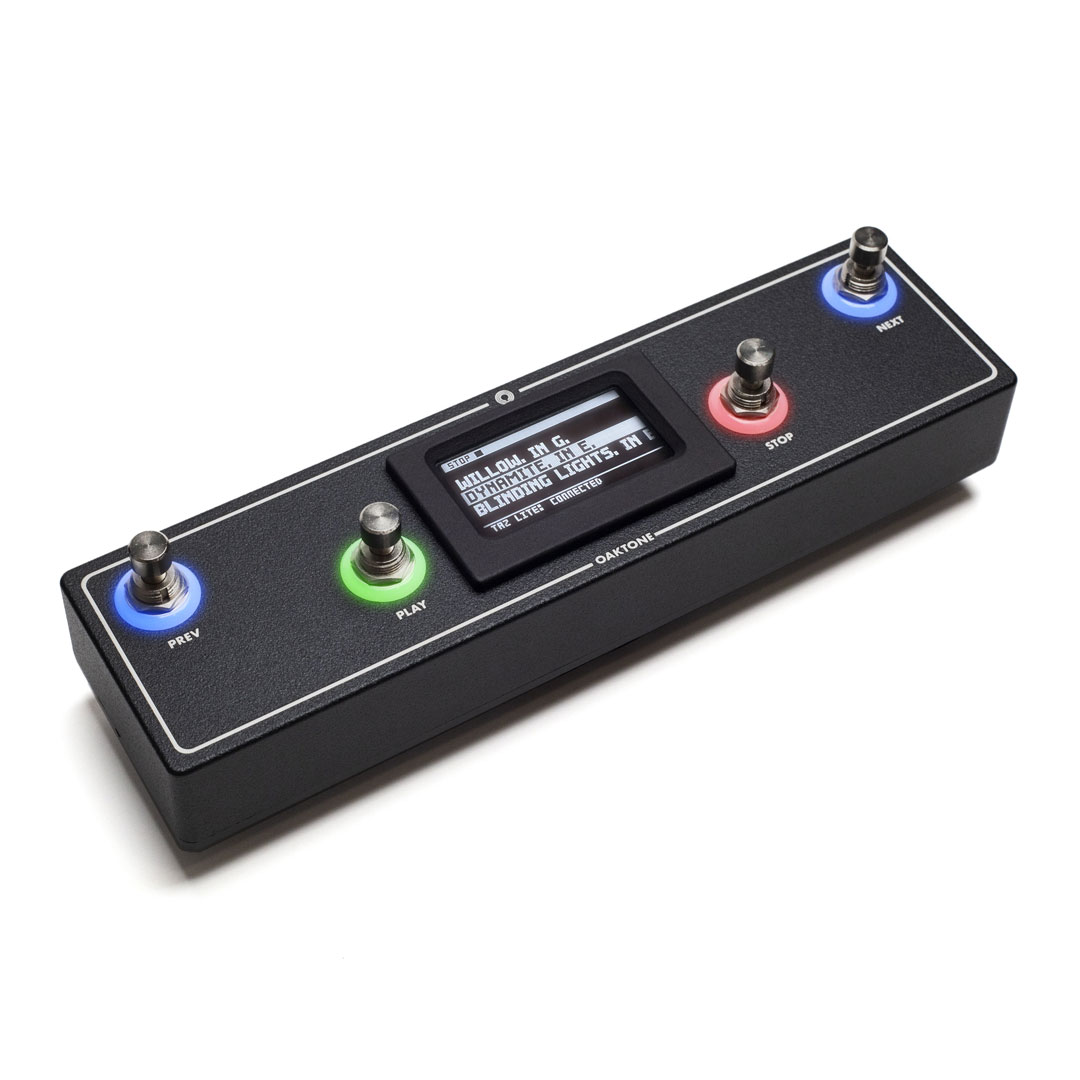 A rectangular electronic pedal device with four footswitches, each lit with colored rings (blue, green, red), and a central display screen showing text. The buttons are labeled PREV, PLAY, STOP, and NEXT.
