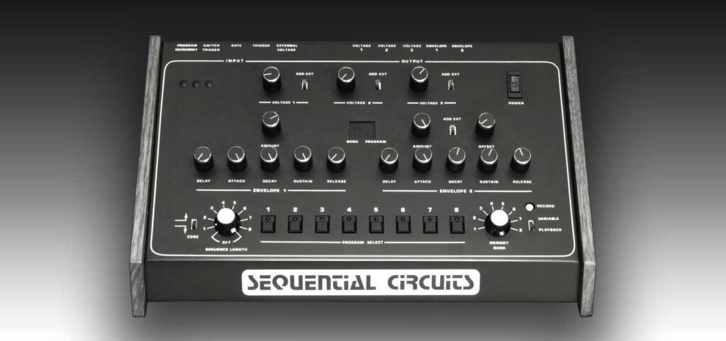 A vintage Sequential Circuits analog synthesizer with various knobs, switches, and buttons on a slanted panel, set against a gradient gray background. The brand name is displayed prominently at the front base.