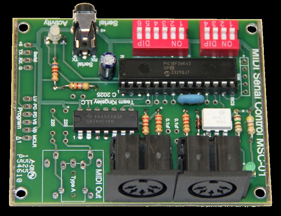 A green printed circuit board labeled Multi Serial Control MSC-01 with various components, including resistors, capacitors, IC chips, two black MIDI ports, a power socket, and red DIP switches.