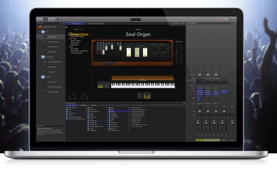 A laptop displays music production software featuring a virtual organ instrument called “Soul Organ,” with various controls, a keyboard, and mixer panels; a blurred concert crowd is visible in the background.