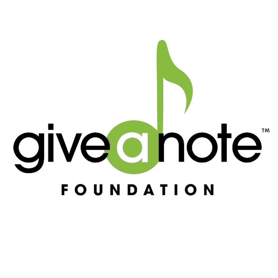 Logo for Give a Note Foundation. The word giveanote is written in lowercase with a in a green circle, and the n is stylized as a green musical note. FOUNDATION is written below in uppercase black letters.