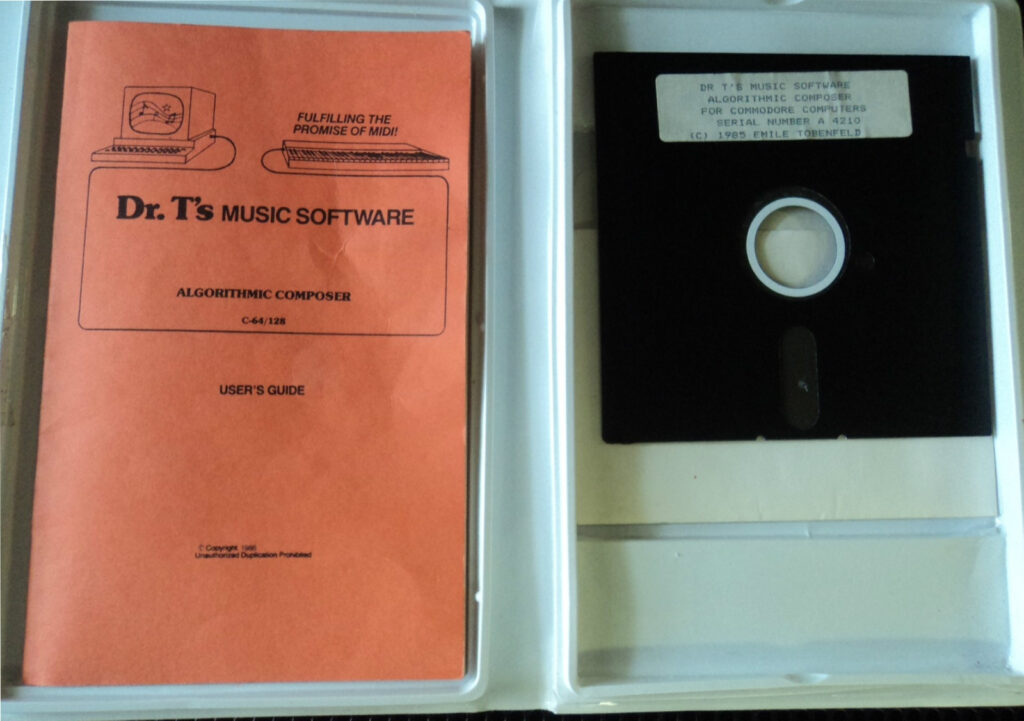 Open case containing an orange Dr. Ts Music Software Algorithmic Composer Users Guide on the left and a black 5.25-inch floppy disk on the right, both for Commodore computers.