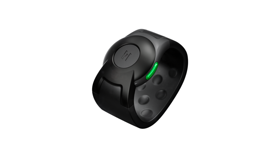 A sleek black wearable wristband with a round face, featuring a single green indicator light on the side, displayed against a plain white background.